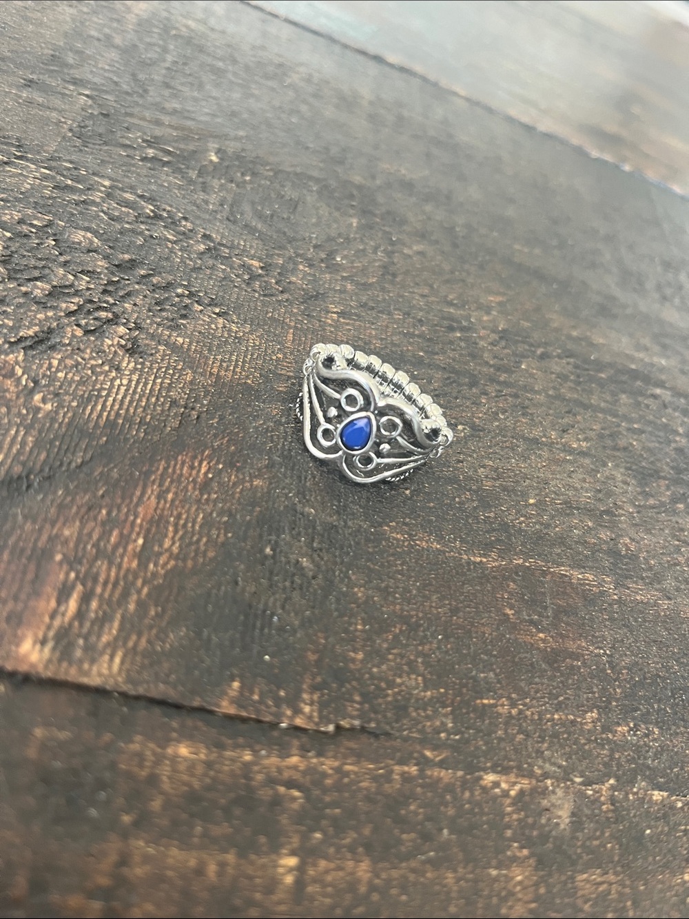 Ornate Silver Ring with Blue Teardrop Stone